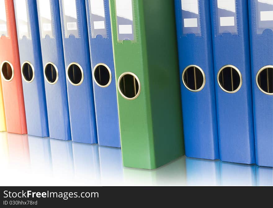 Ring binders in row and reflection