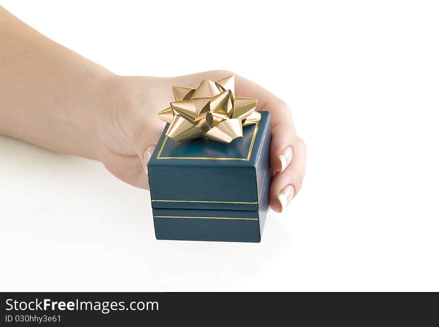 Gift in box on the hand isolated on white