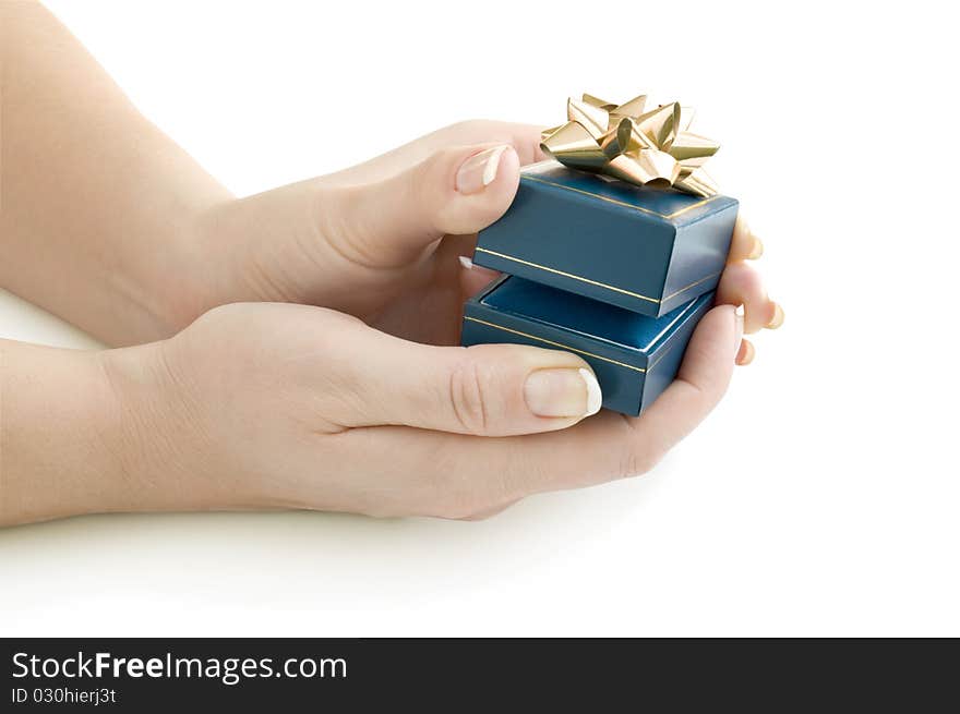 Gift in box on the hands isolated on white