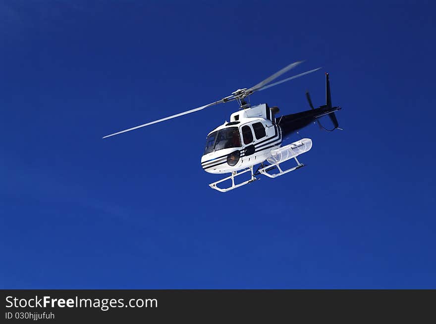 Approaching emergency helicopter in skiing area. Approaching emergency helicopter in skiing area