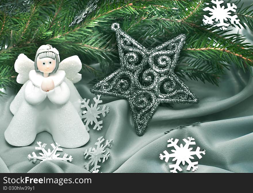 Christmas composition: Angel, a star and a fur-tree branch. Christmas composition: Angel, a star and a fur-tree branch