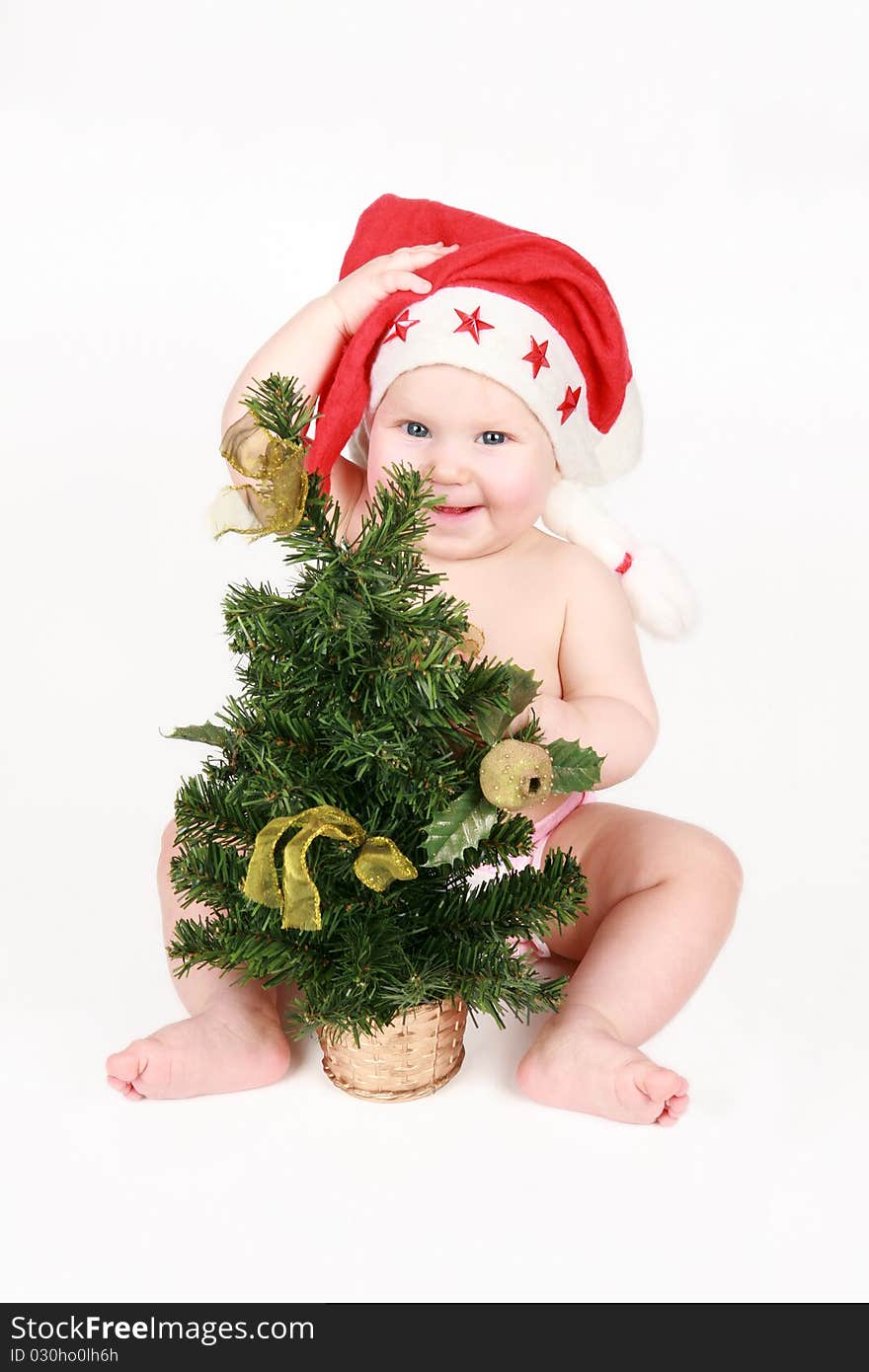 The happy gnome with a Christmas fur-tree on a white background