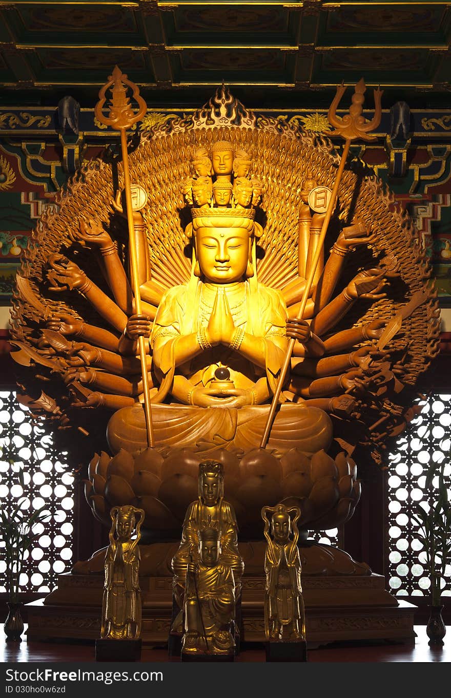 Thousand hands golden Buddha in dragon temple,Thailand