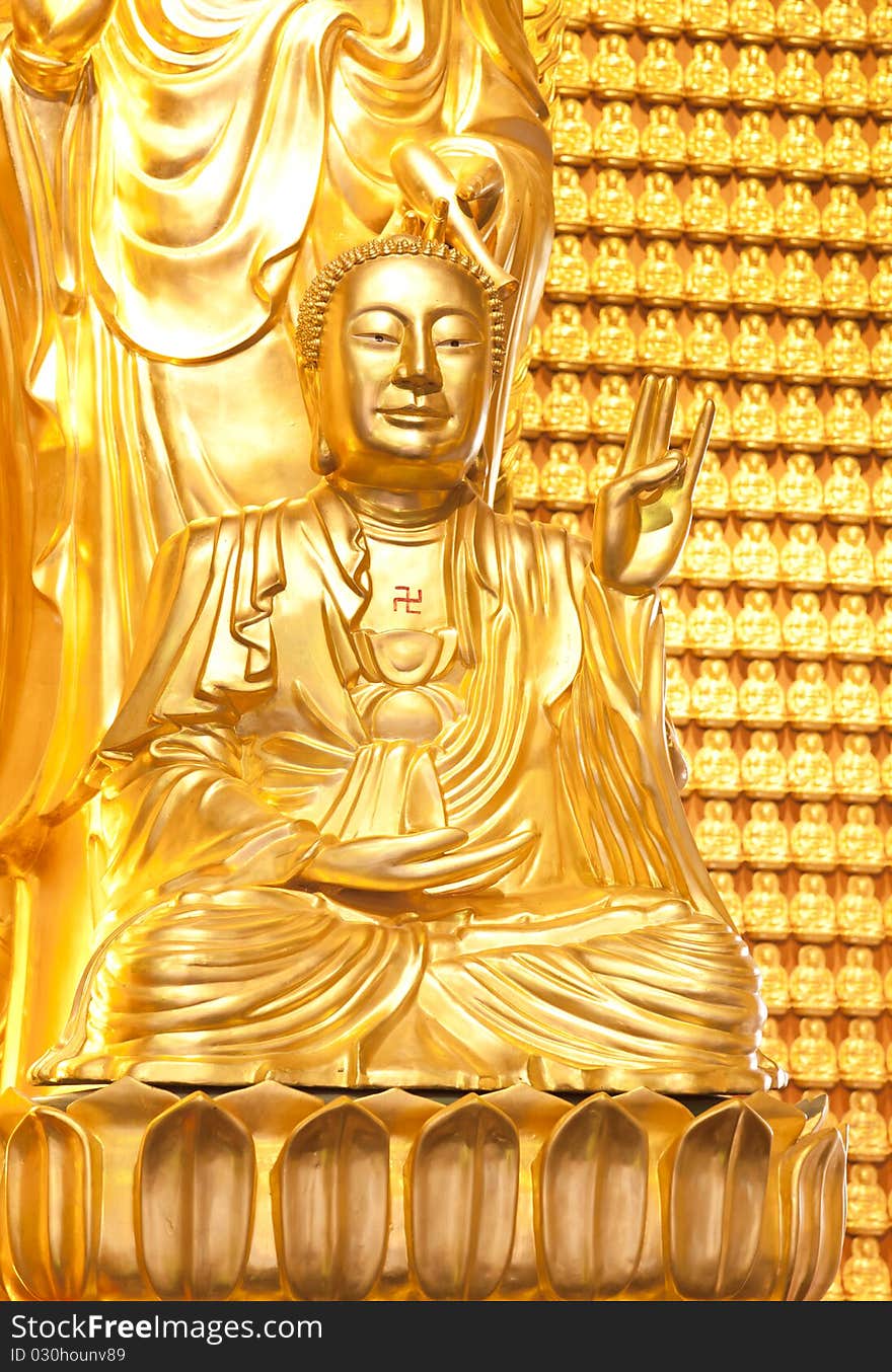 Golden Buddhist monk in dragon temple