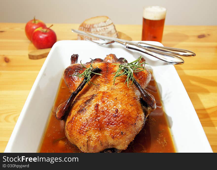 Food styling of baked duck with rosemary