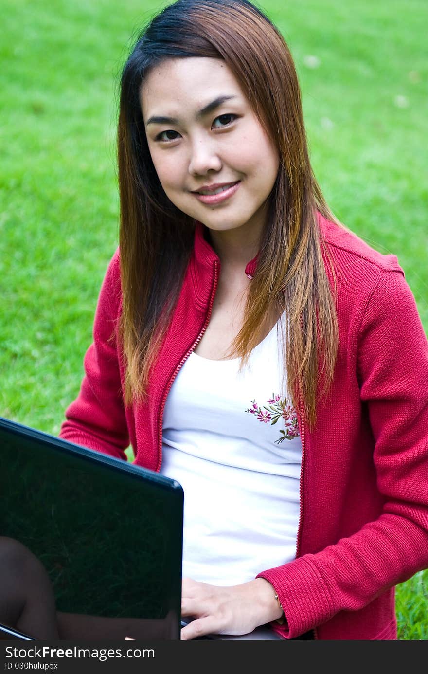 Portrait of the young beautiful with computer