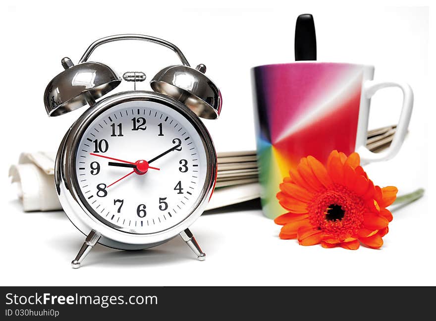 Newspaper, clock, cup of coffee and red daisy on white background. Newspaper, clock, cup of coffee and red daisy on white background