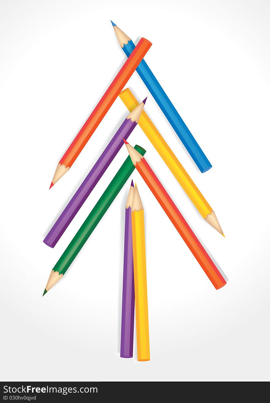 Christmas tree composed of colored pencils on white background