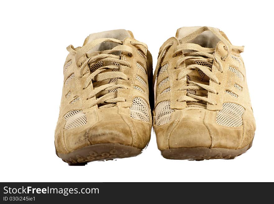 Pair of old sneakers isolated on a white background