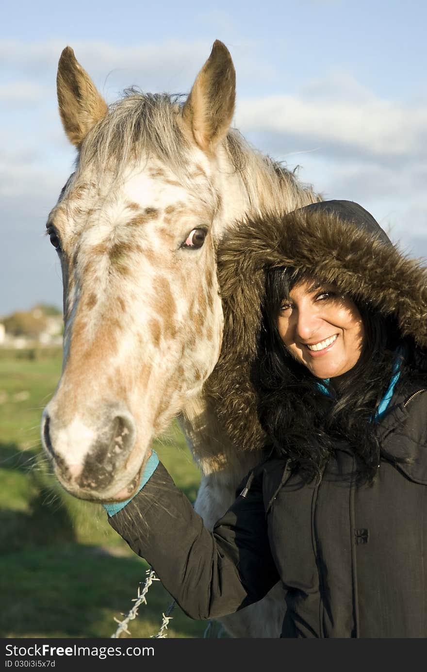 Woman Petting Horse