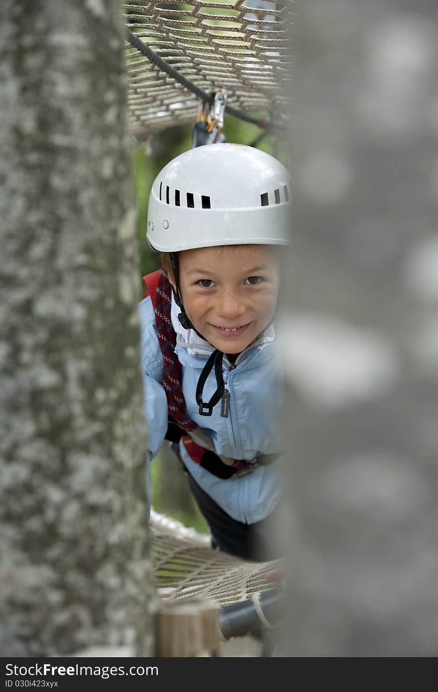 Little boy climbing in adventure park. Little boy climbing in adventure park