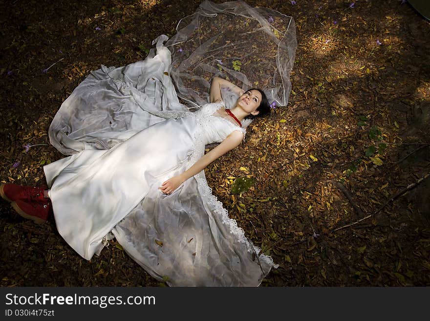 Trash the dress in autumn forest