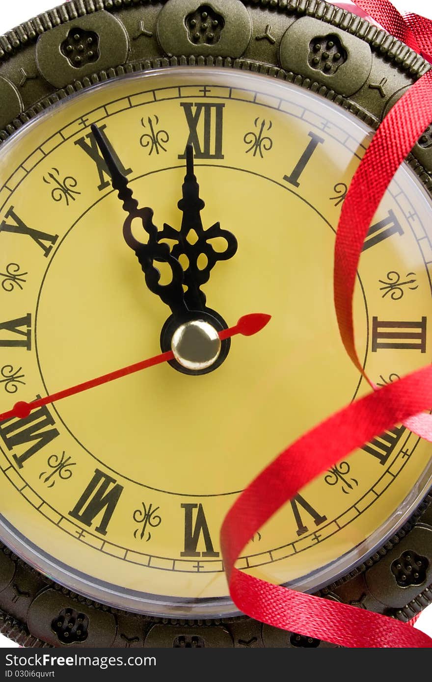 Face of an antique clock shows almost twelve