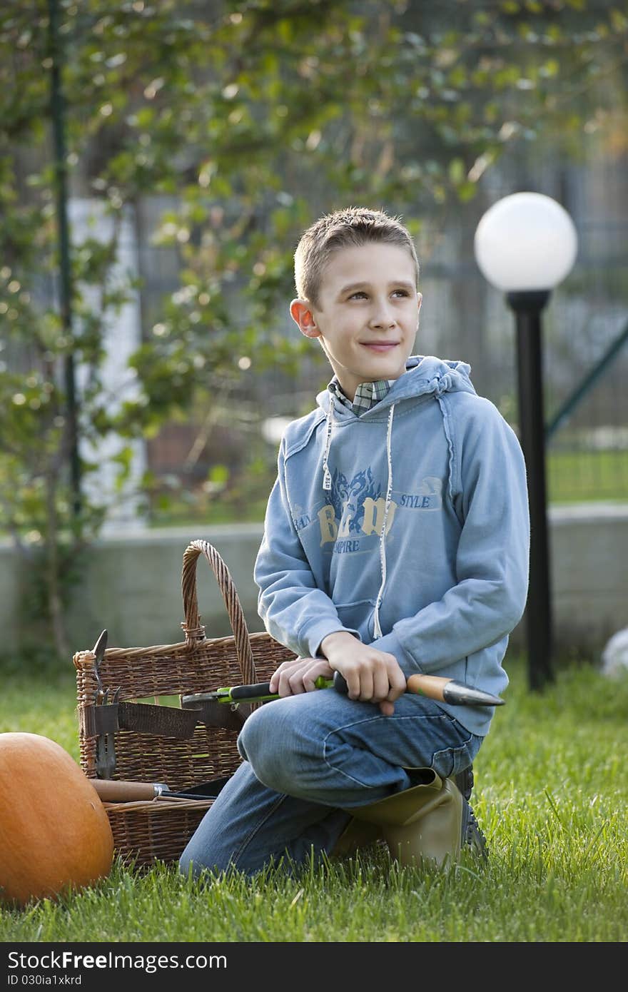 Little boy doing gardening, outdoors. Little boy doing gardening, outdoors