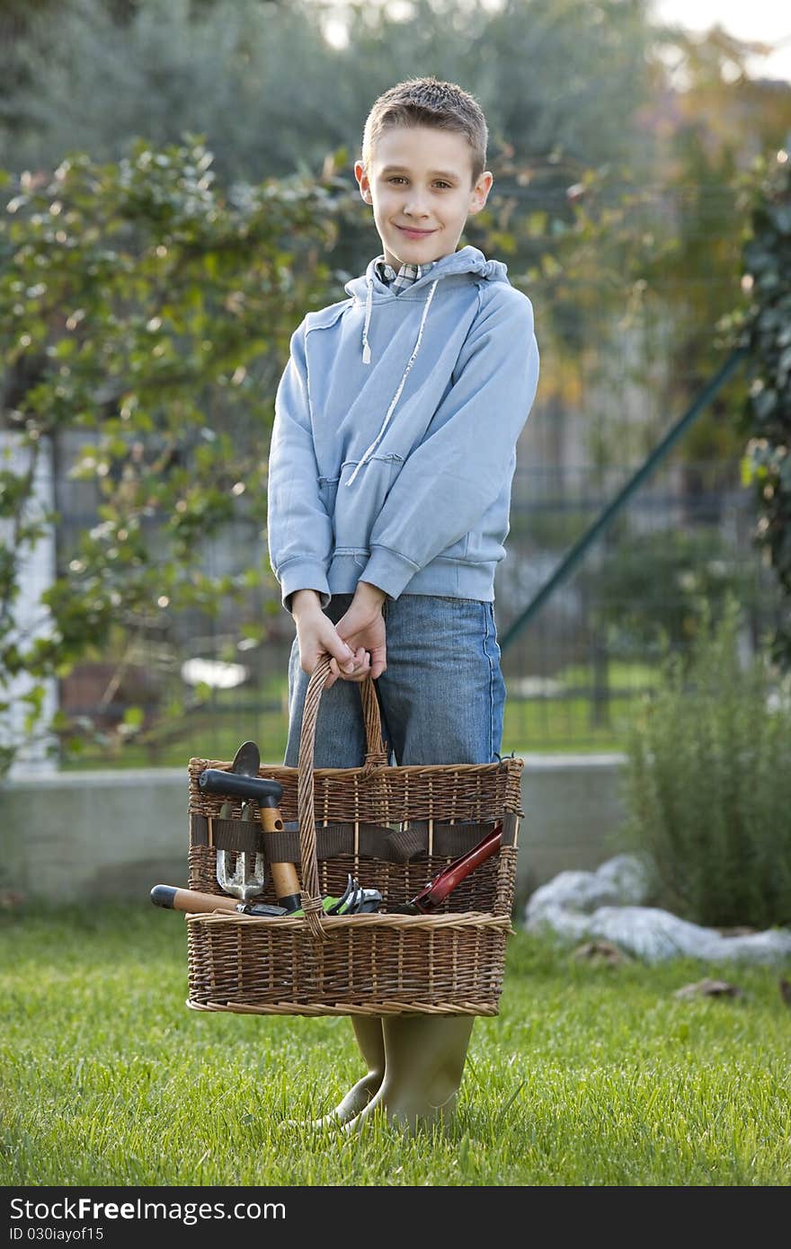 Little boy doing gardening, outdoors. Little boy doing gardening, outdoors