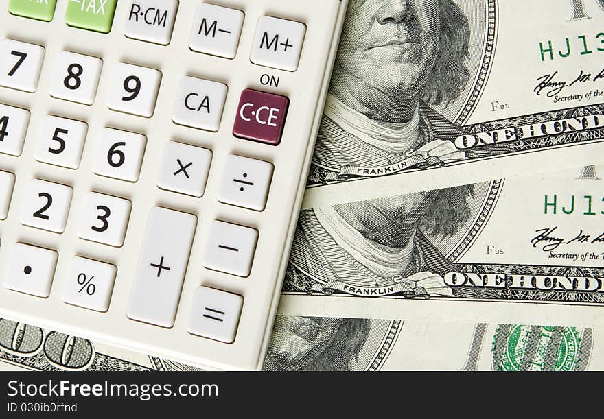 Business concept. Dollars; calculator on white background