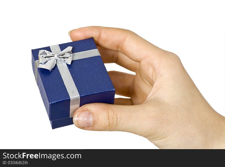 Small dark blue gift in a female hand. Small dark blue gift in a female hand