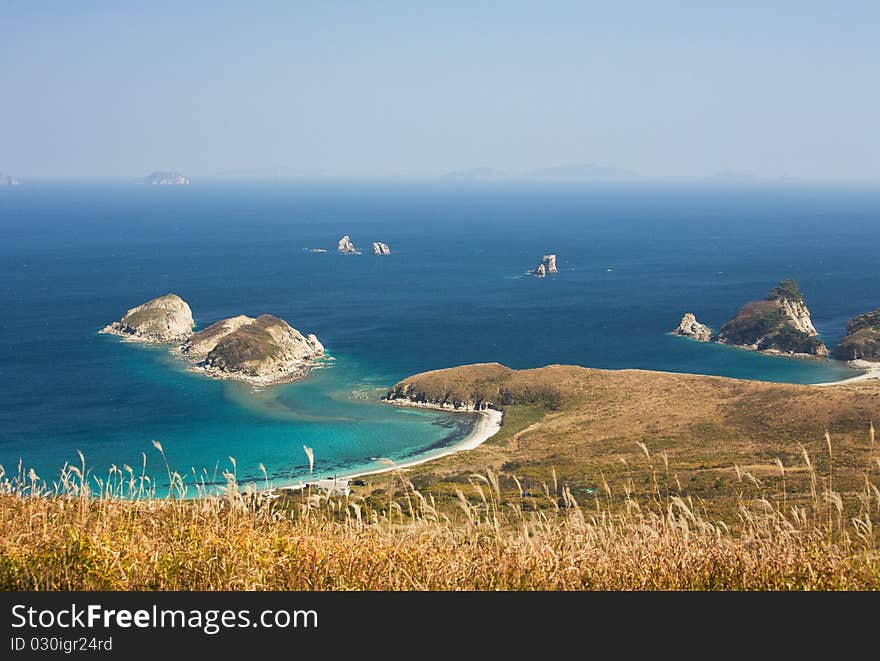 Waterscape, emerald forest and marine blue combines the thin strip of beach. Waterscape, emerald forest and marine blue combines the thin strip of beach