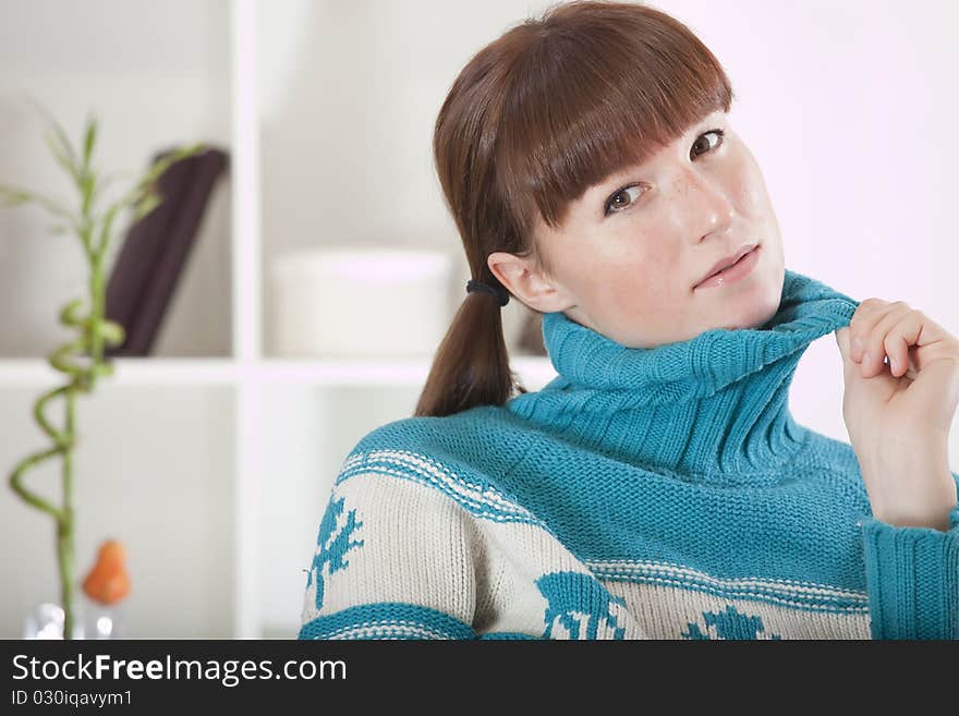 Woman in knit jumper, sweater relaxing at home