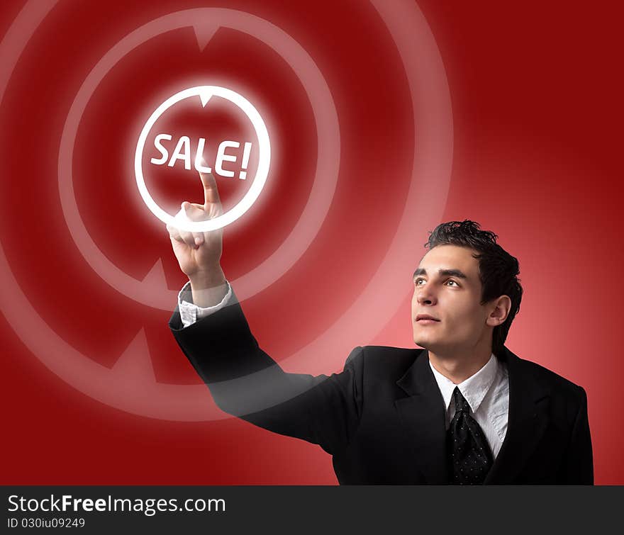 Business man pressing a SALE button. Business man pressing a SALE button