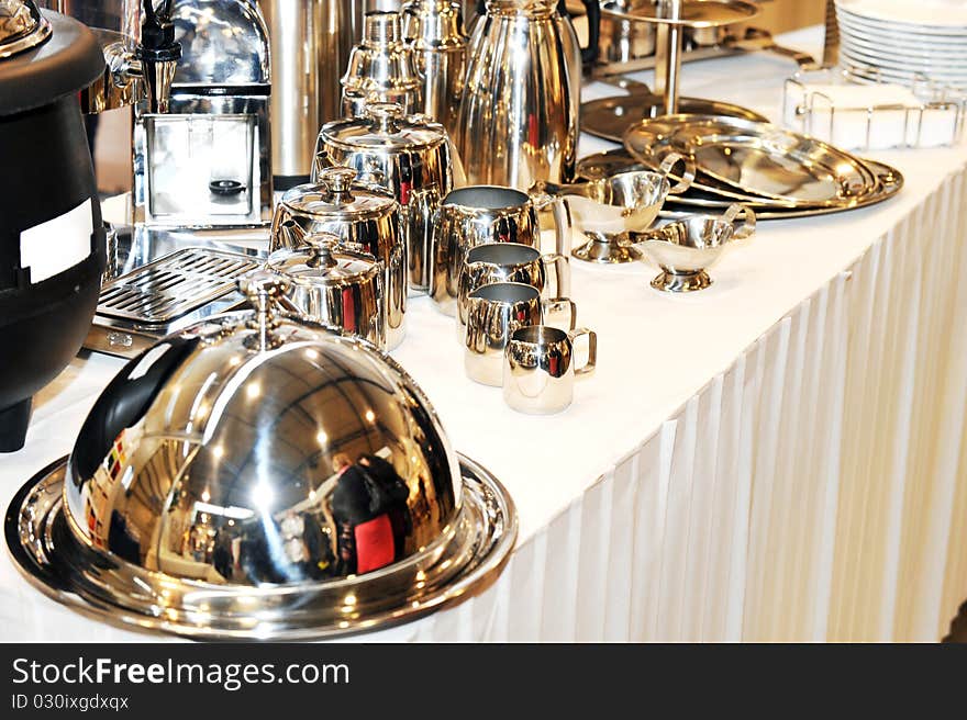 Turkish coffee pot (cezve) and traditional utensils of stainless on table