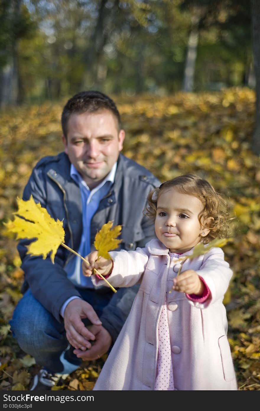 Dad and daughter having fun in the park