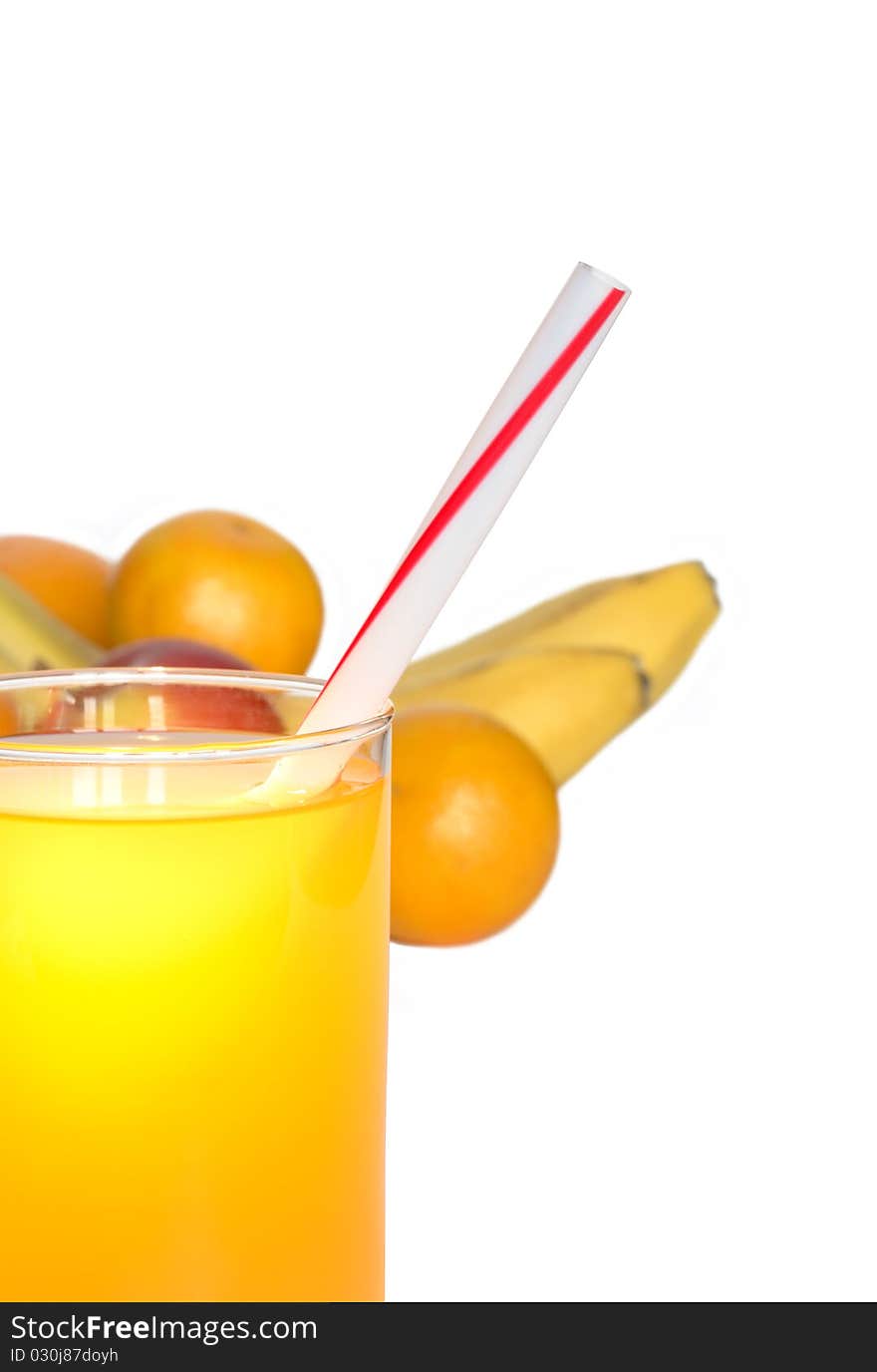 Glass of juice closeup on white background with various fruits. Glass of juice closeup on white background with various fruits