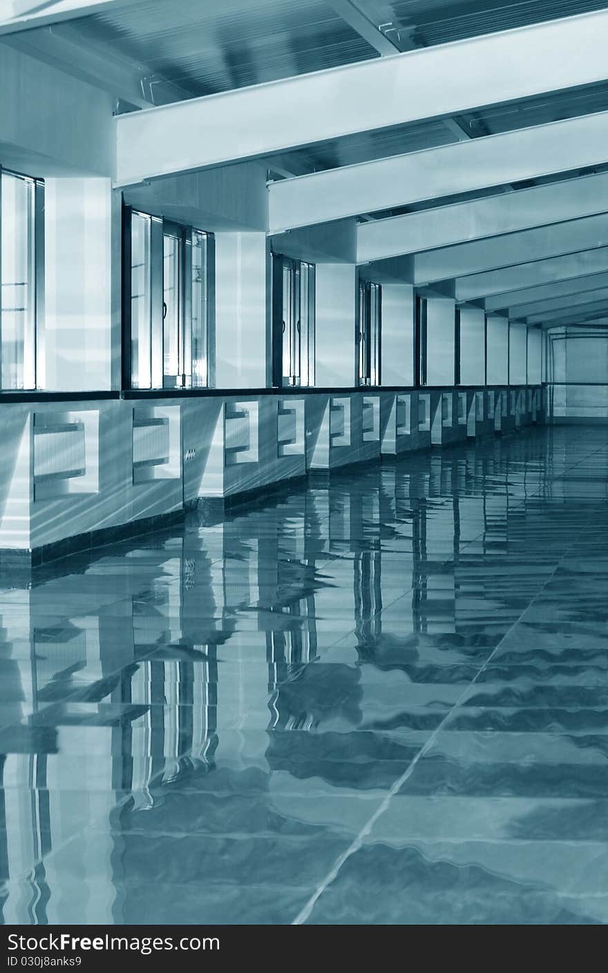 Empty entrance hall with high windows. Blue-gray tone. Empty entrance hall with high windows. Blue-gray tone