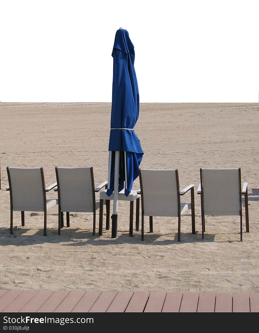 Chairs And Umbrella On Sandy Beach