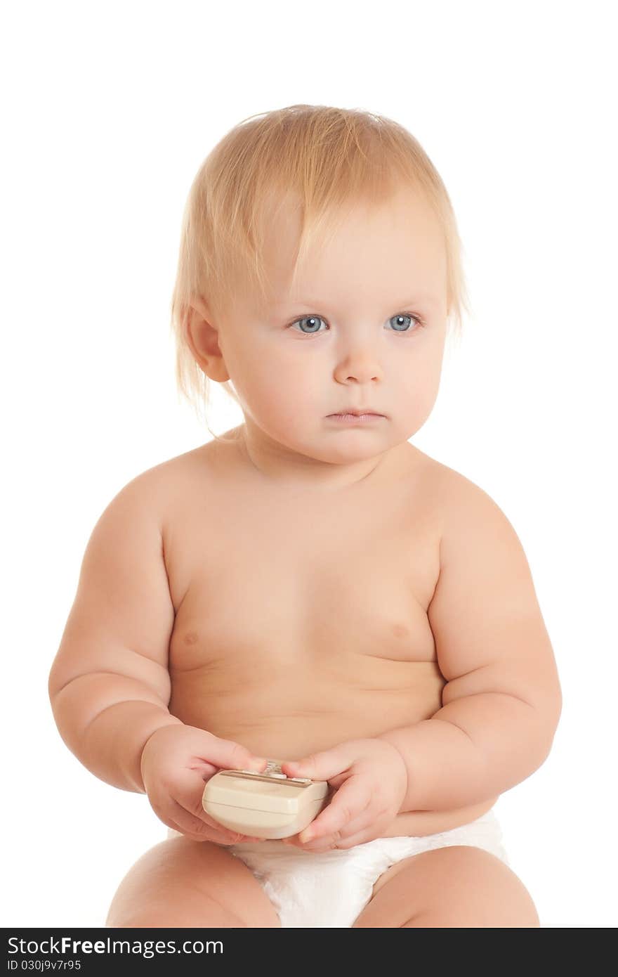 Portrait of happy young sitting baby with phone in hand