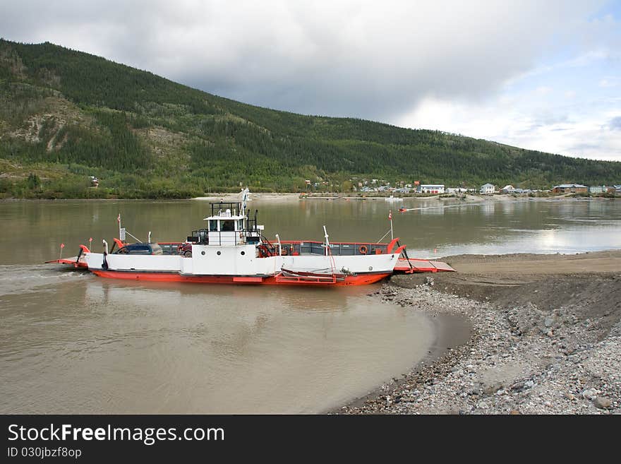 A ferry crosses the Yukon River near Dawson City for the Top of the World Highway. A ferry crosses the Yukon River near Dawson City for the Top of the World Highway