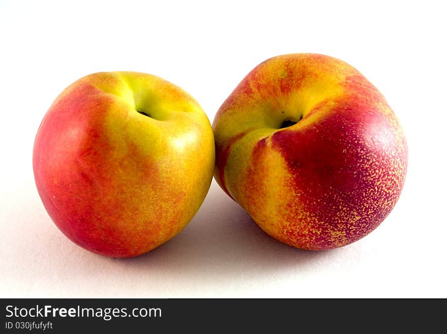 Ripe nectarine on white background