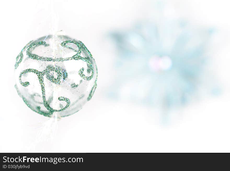 Transparent christmas ball with bluring snowflake