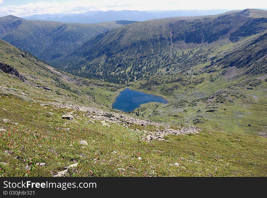 Landscape in the heart of the blue lake green mountains. Landscape in the heart of the blue lake green mountains