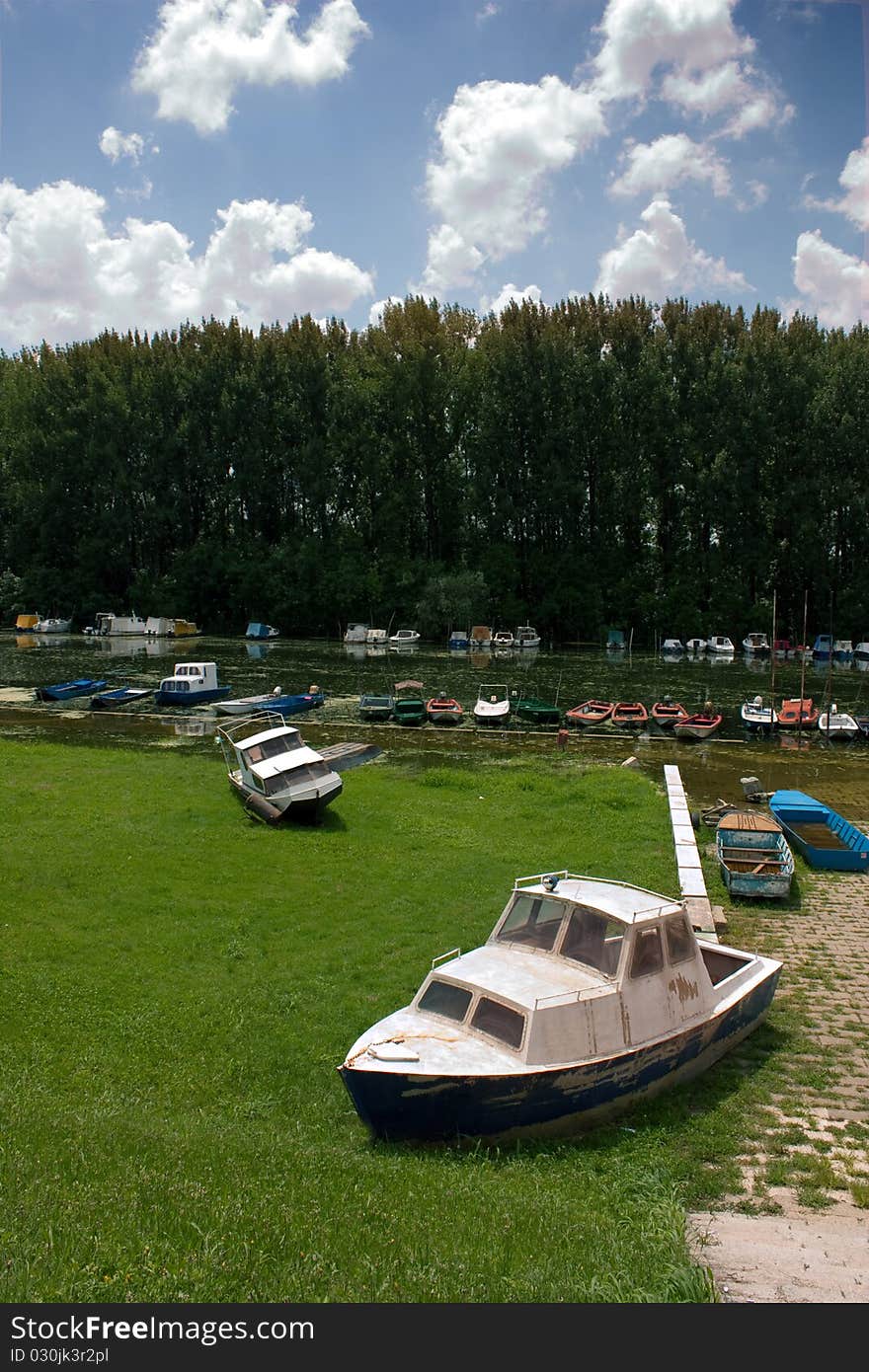 Flooded river and floating boats. Flooded river and floating boats