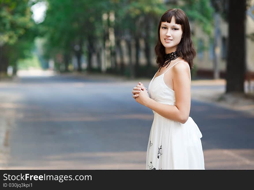 Portrait of naturally beautiful woman in her twenties, shot outside in natural sunlight