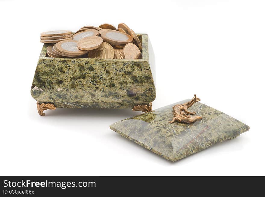 Casket with coins on a white background