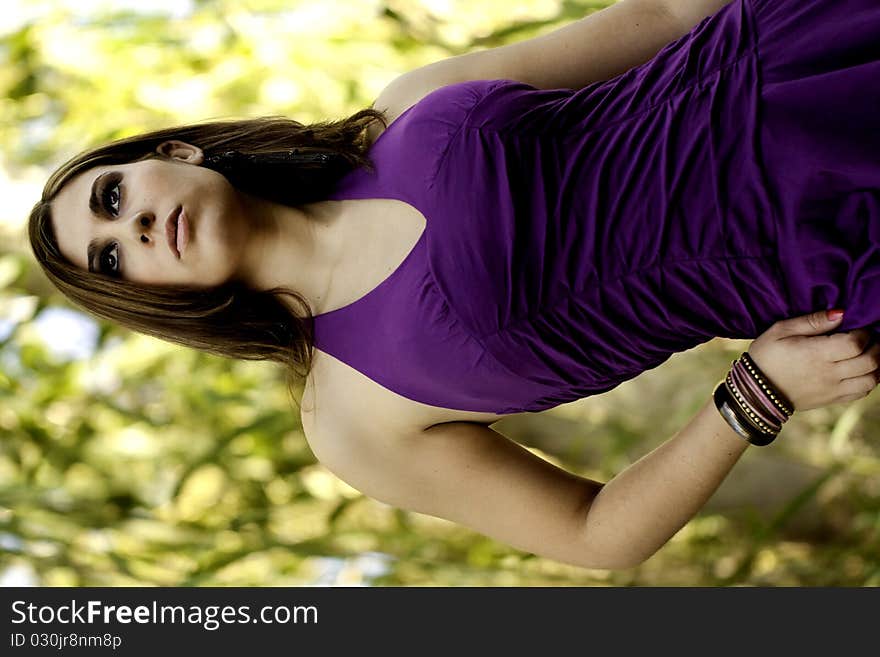 View of a beautiful woman on a narrow bridge. View of a beautiful woman on a narrow bridge