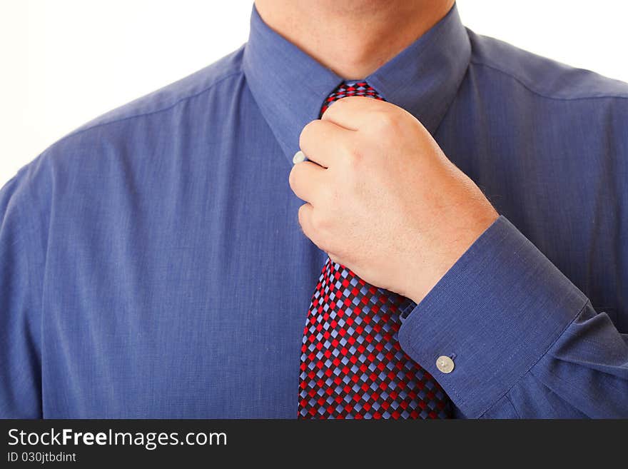 Businessman adjusting his tie