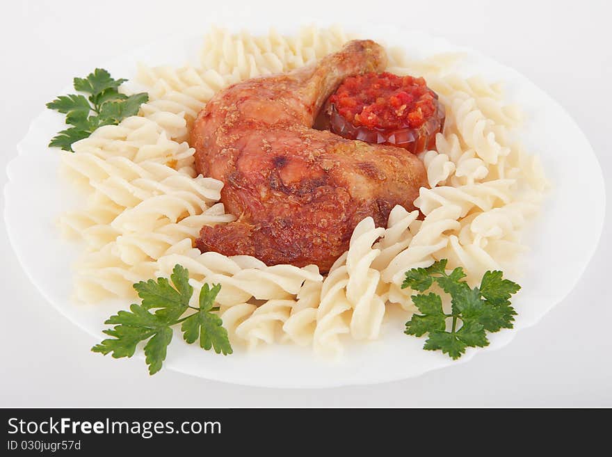 Grilled chicken on a plate with pasta. Grilled chicken on a plate with pasta