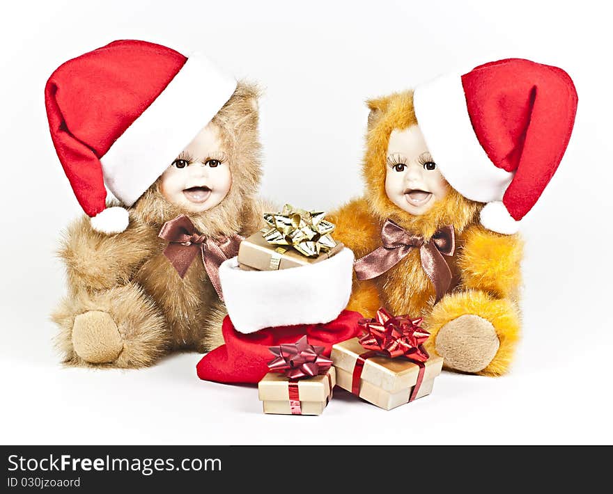 On a white background are two porcelain bears a Christmas gift bag. On a white background are two porcelain bears a Christmas gift bag.