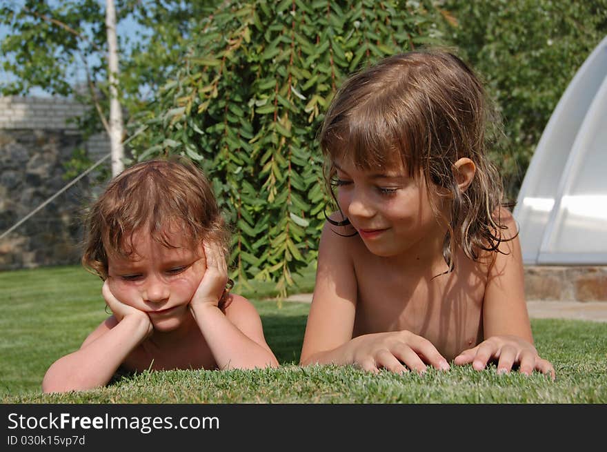 Two little girls playing in garden. Two little girls playing in garden