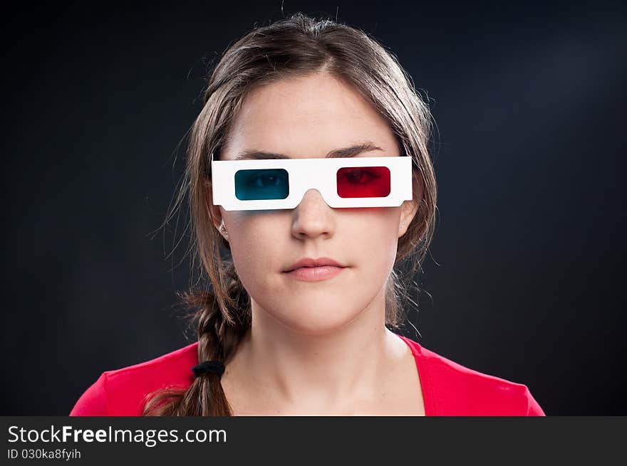 Teenager with 3D glasses watching movie