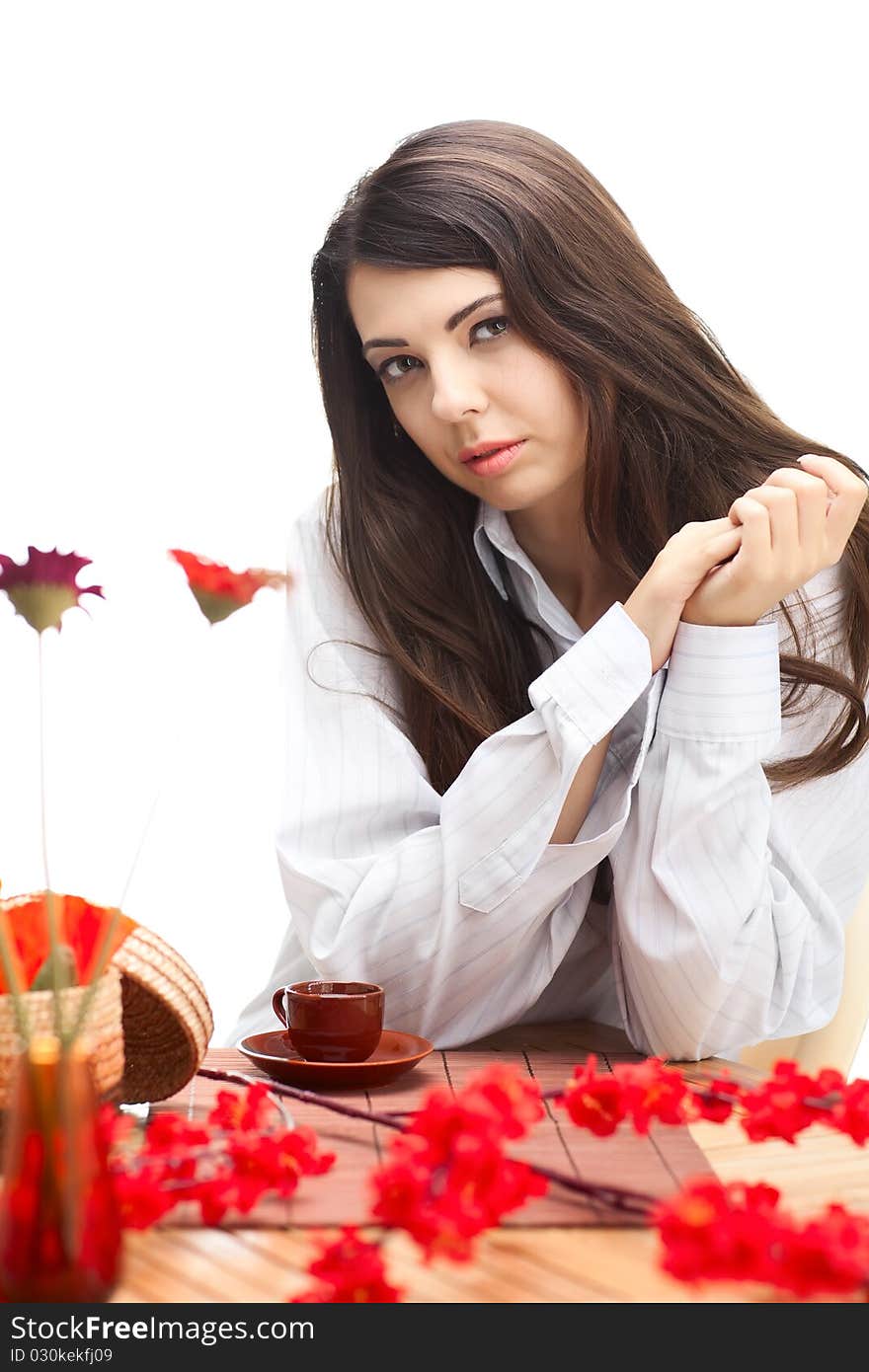 Woman dirinking tea smiling and looking at camera wearing formal clothes. Woman dirinking tea smiling and looking at camera wearing formal clothes