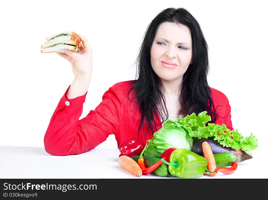 Beautiful woman  with vegetables over white background