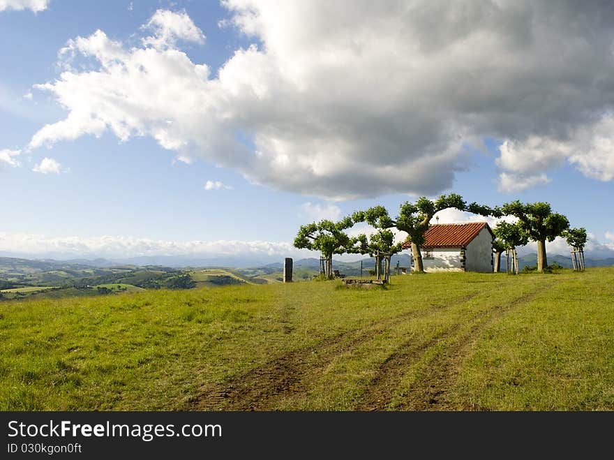 Chapel at the top of the hill before the Pyrenees Mountains. Chapel at the top of the hill before the Pyrenees Mountains.