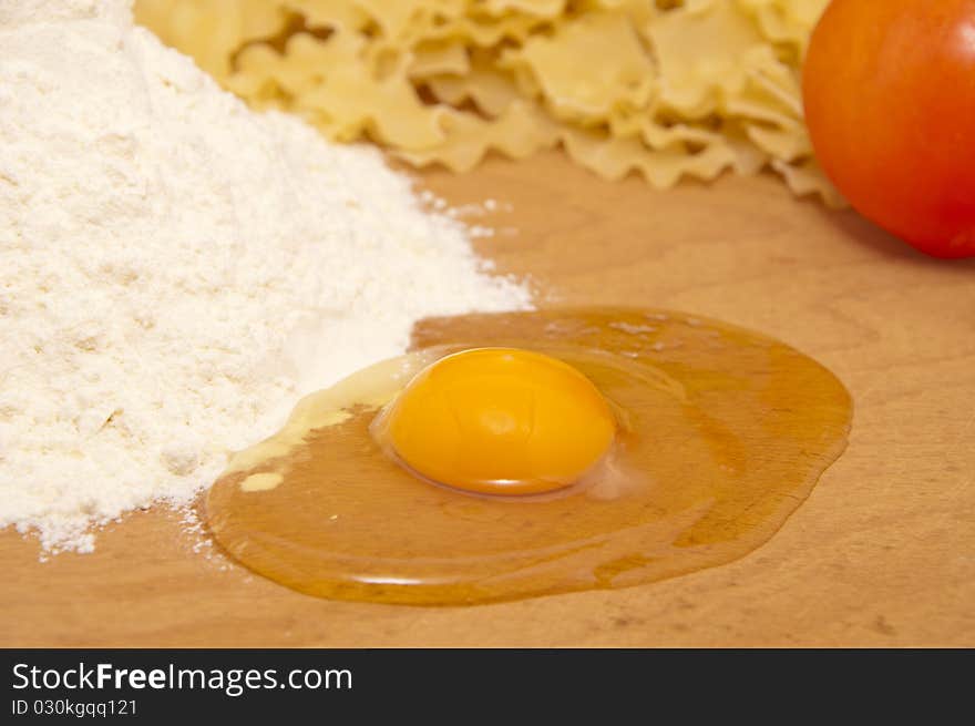 Nice fresh pasta ingredients on a board to knead dough