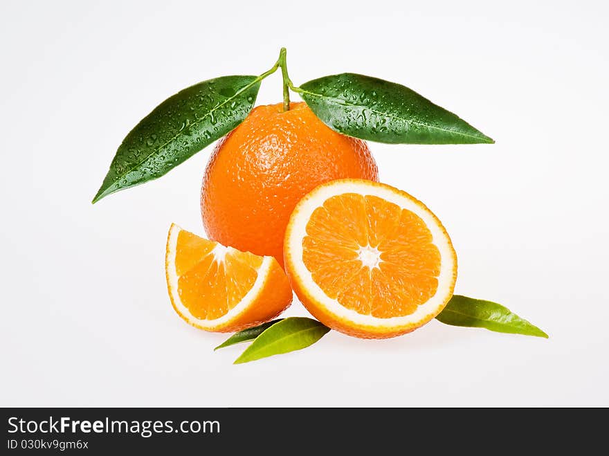 Freash oranges with leaves on white background