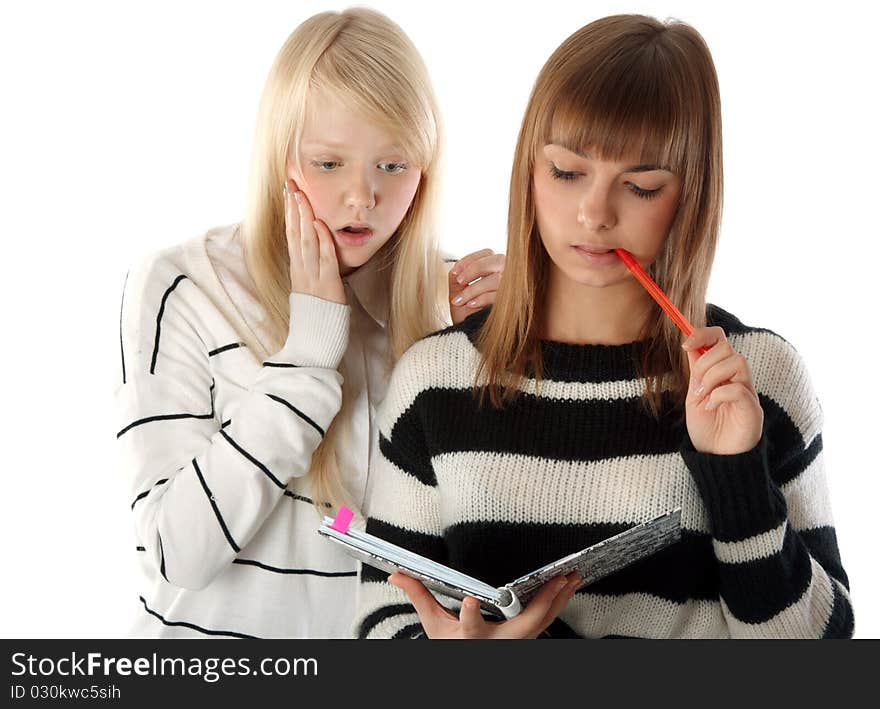 Two beautiful girls read diary book on white background