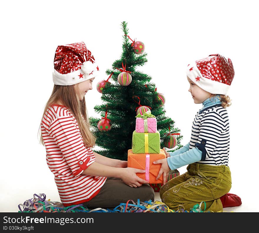 Two little girls at the new year tree. Two little girls at the new year tree